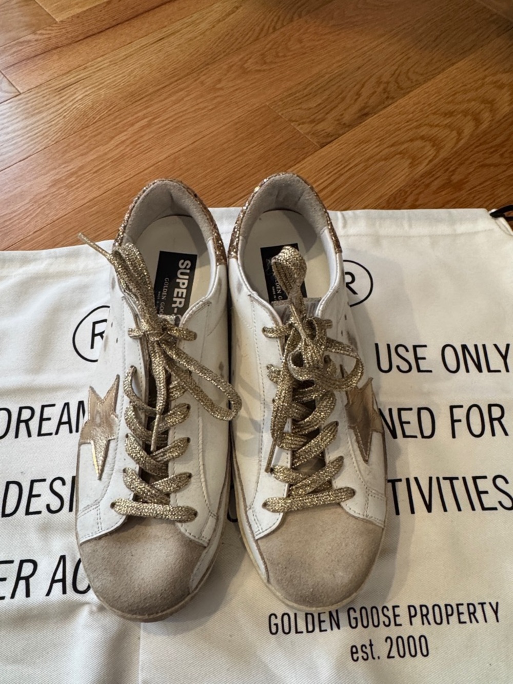 Golden Goose gold glitter sneakers